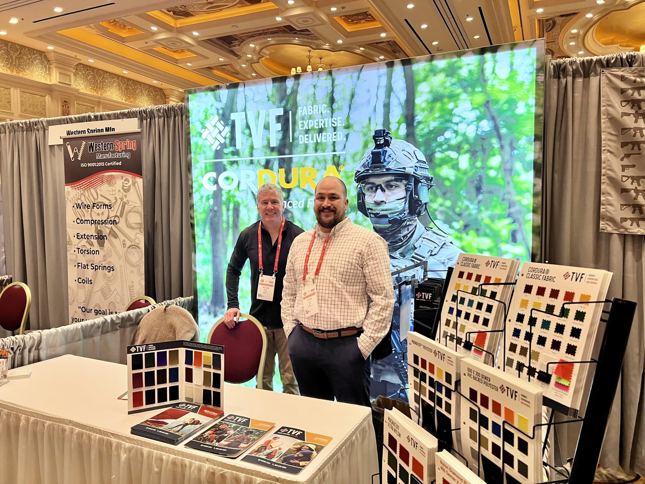 TVF Senior Sales Consultant Kevin Blake is pictured to the left of TVF Senior Sales Consultant Ryan Lower at the TVF trade show booth for the SHOT Week Supplier Showcase in Las Vegas.